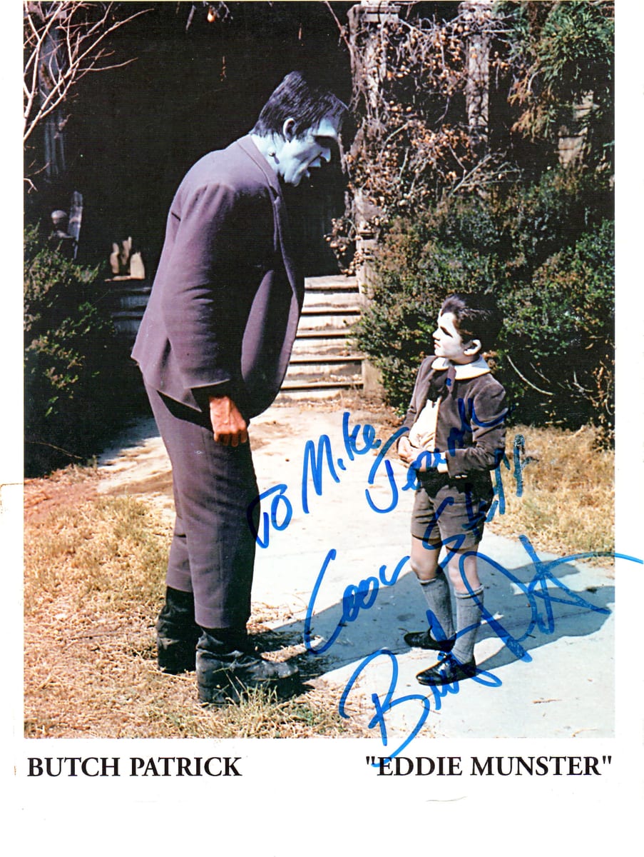 Signed publicity photograph of actor Butch Patrick in character as Eddie Munster, inscribed in blue marker